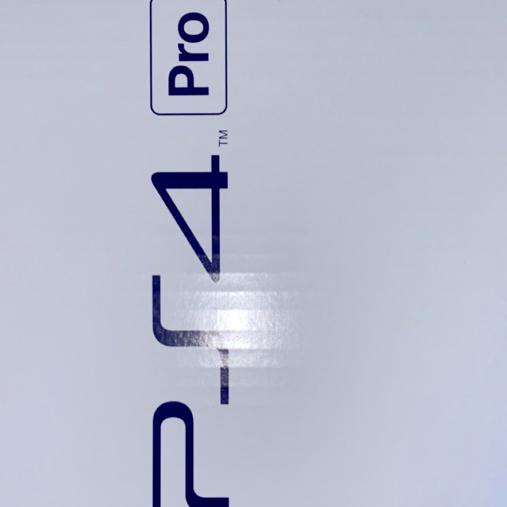 playstation 4 with three remote controllers with attachments, multiple games